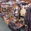 Wide selection of firearm accessories, rifle cases, scopes, and gun parts inside Pickett Weaponry's retail showroom in Newberry, FL.