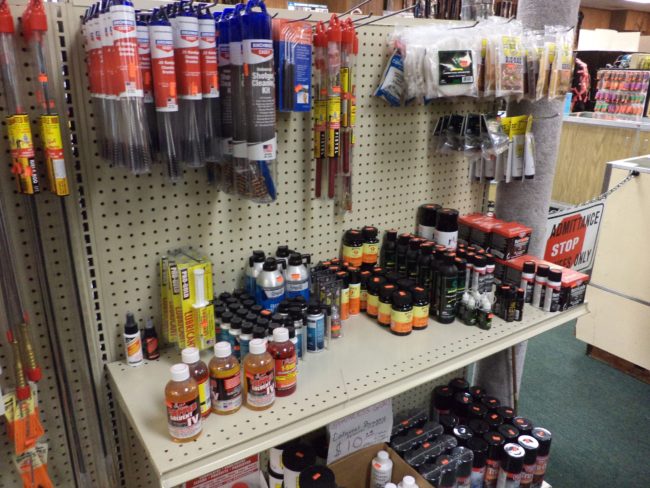 Wall display of gun cleaning supplies at Pickett Weaponry in Newberry, FL.